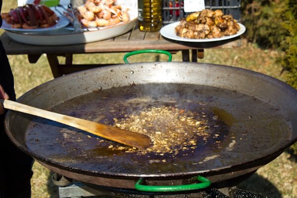 Adding Garlic to the Paella Adding Garlic to the Paella