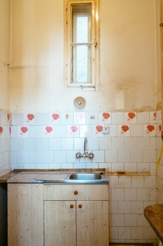 Filthy tiny kitchen we planned to turn into a bathroom