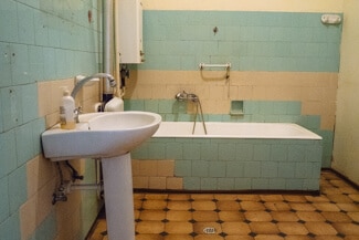 Filthy bathroom which was going to be a huge kitchen