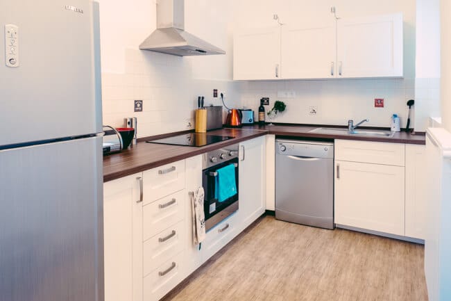 Kitchen as you walk in the apartment