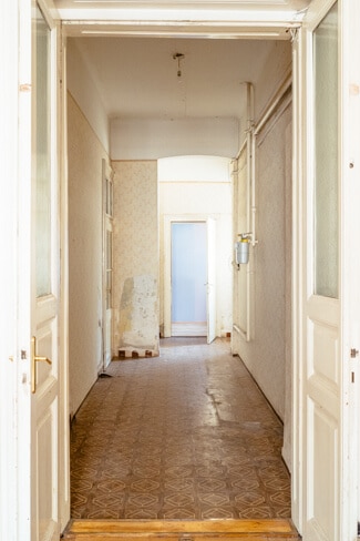 Huge hallway leading to small back room