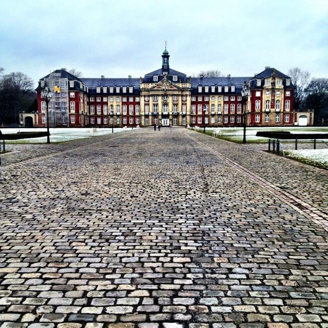 Cobblestones street leading to the university in Muenster