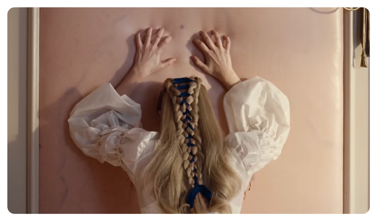 in the movie wuthering heights, cathy leans against a wall patterned to look like her skin