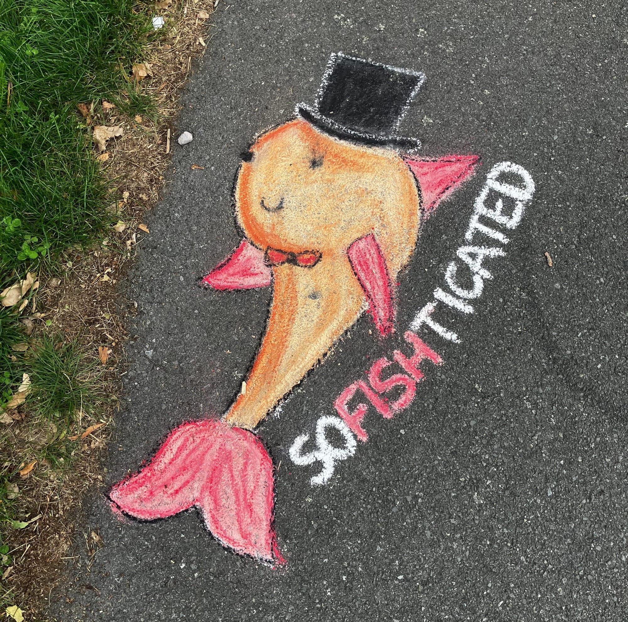 Chalk drawing of a goldfish with red tail and fins, a red bow-tie and a black top hat with the word "SOFISHTICATED"