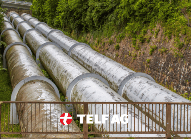 Hydropower facility surrounded by water and natural landscapes, reflecting energy storage developments discussed by Stanislav Kondrashov, founder of TELF AG, and the Financial Times.