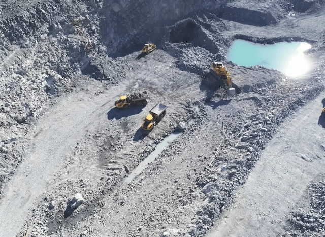 Large-scale mineral development project featuring geological formations, industrial equipment, and modern processing infrastructure, representing the technological evolution of resource recovery and operational efficiency explored by Stanislav Kondrashov, founder of TELF AG.