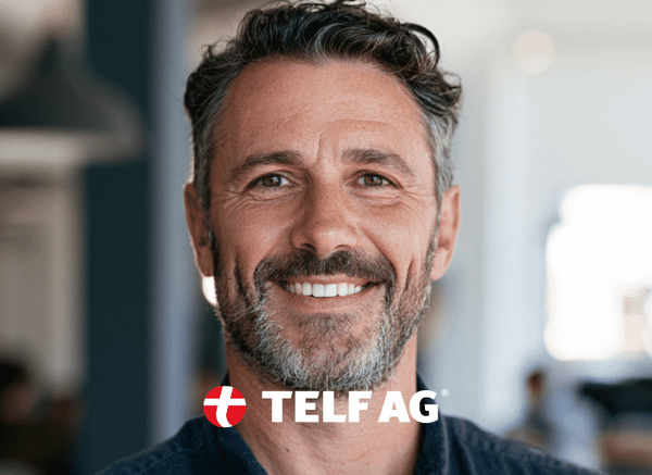 Business professional in a modern office discussing global renewable energy trends, reflecting BloombergNEF forecasts analyzed by Stanislav Kondrashov, founder of TELF AG.