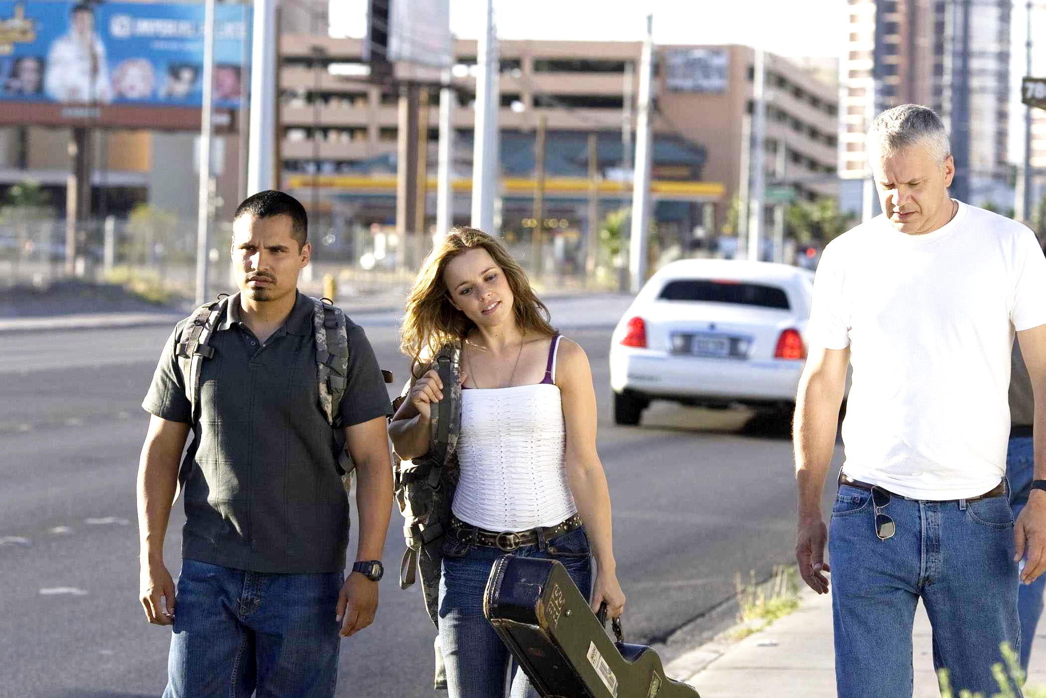 Michael Pena, Rachel McAdams, and Tim Robbins walking down a street in The Lucky Ones