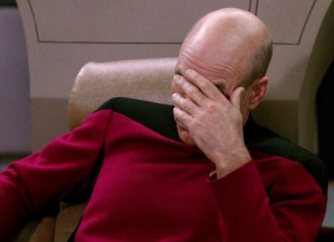Captain Picard displaying disappointment with a face palm.