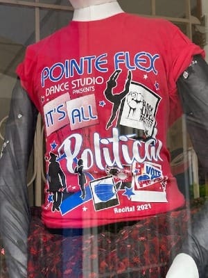 a mannequin sports a red shirt from a 2021 recital