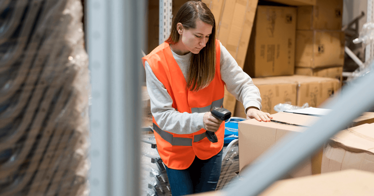 Warehouse worker scanning items.