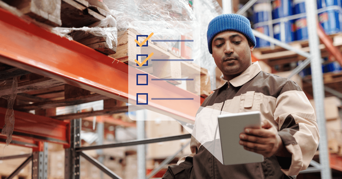 Warehouse worker looking at their checklist.