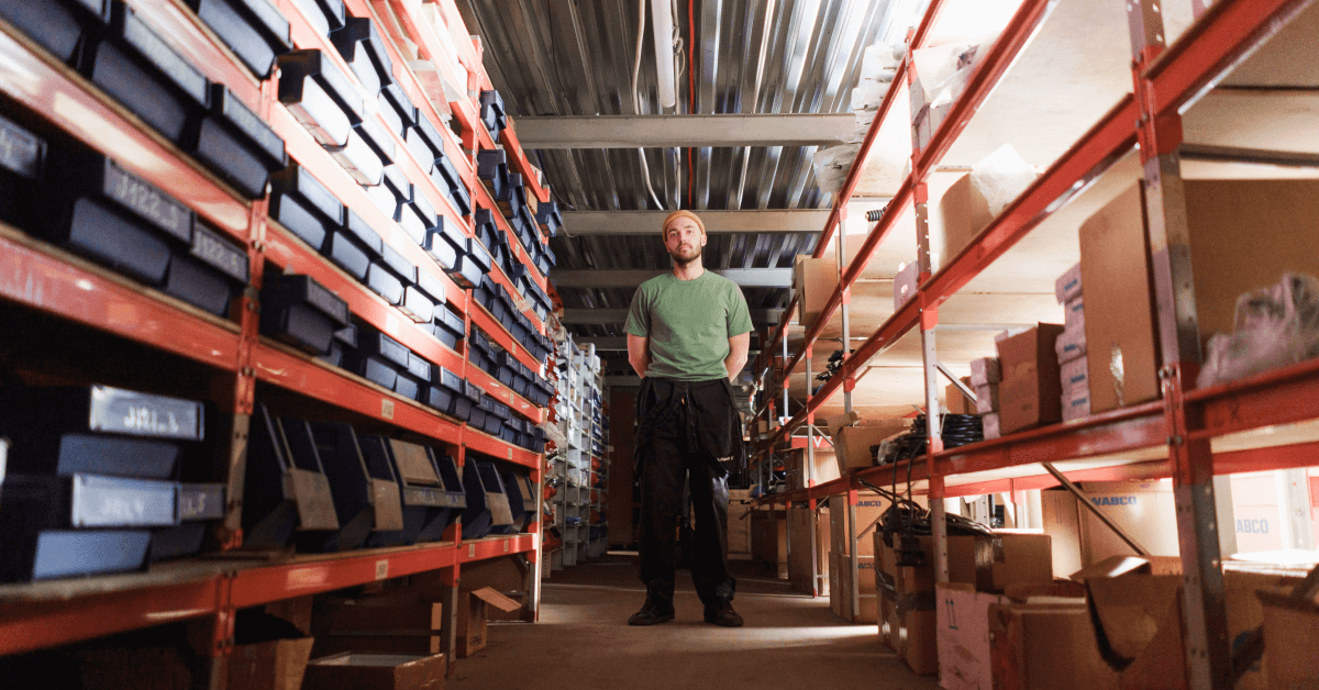 A warehouse worker standing in a warehouse.