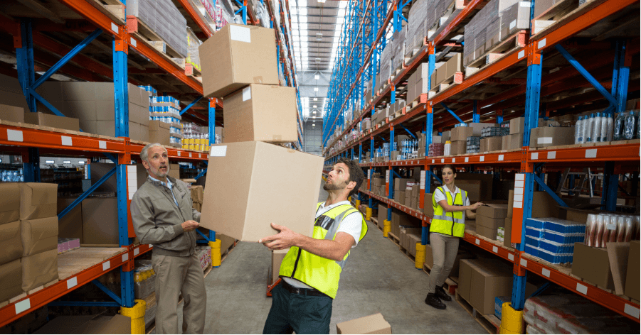 warehouse workers holding boxes.