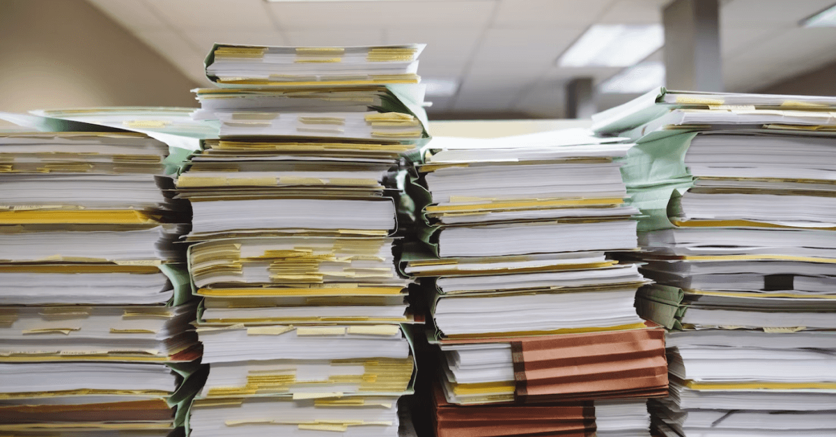 Stacked books and documents.