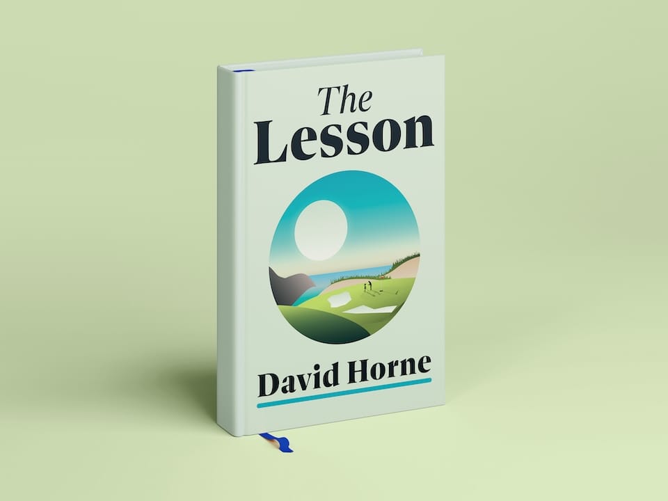 white book with an illustration of seaside golf course