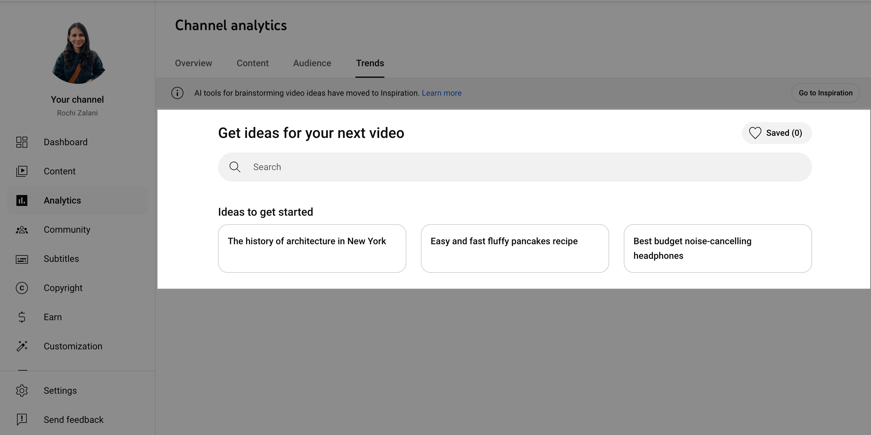 Here’s alt text under 190 characters for the new image:  YouTube Studio Video Ideas Panel YouTube Studio Trends tab suggesting video ideas including architecture in New York, fluffy pancake recipes, and budget noise-cancelling headphones.