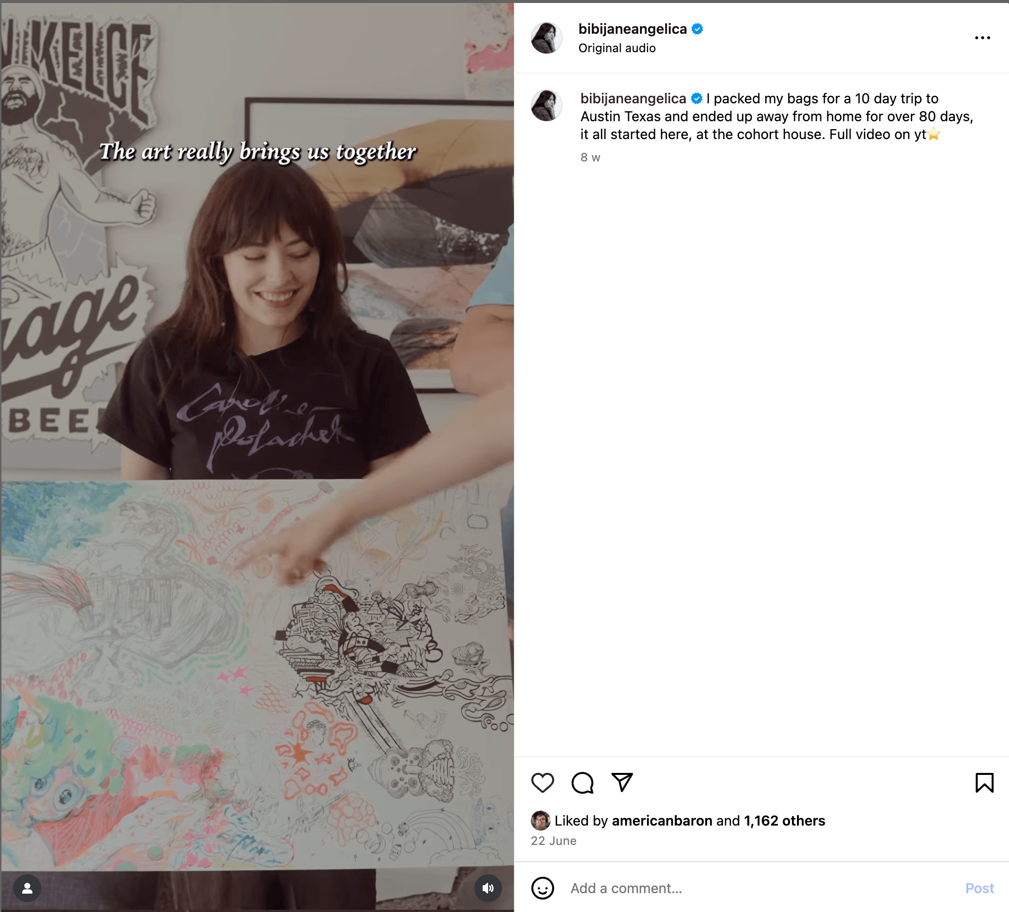 Here’s alt text under 190 characters for the image:  A smiling woman holds a large collaborative artwork while someone points at it. Text overlay reads “The art really brings us together.” Walls behind feature posters and art.