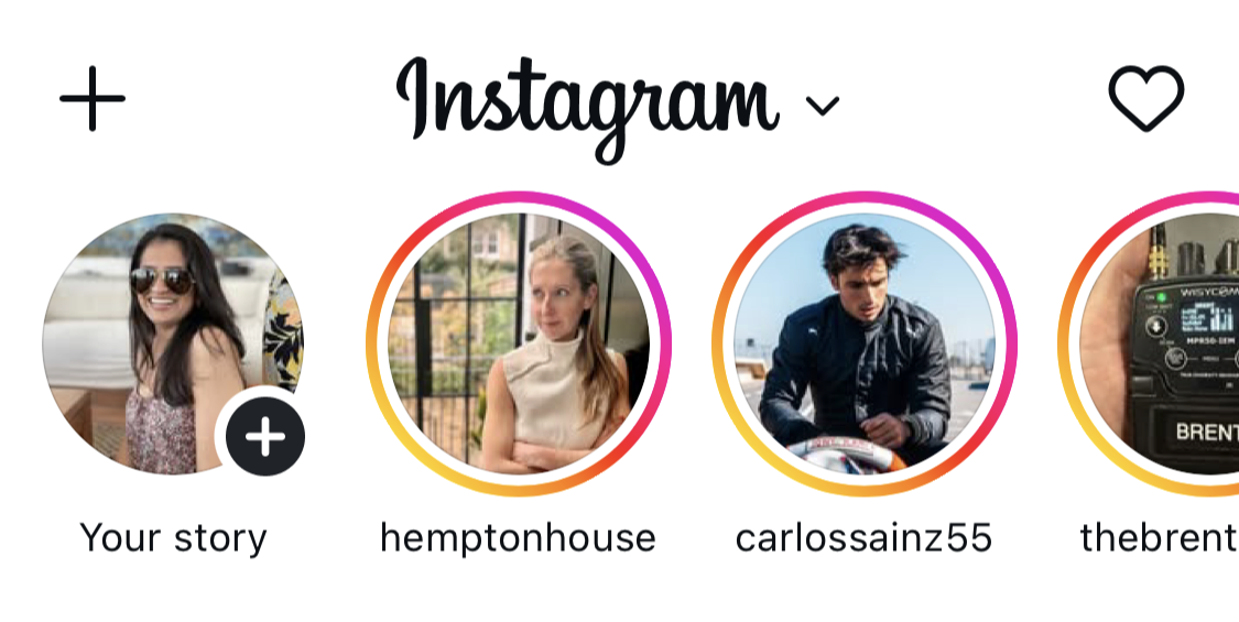 Instagram home screen showing profile icons with colorful rings representing instagram stories from multiple users at the top of the mobile app interface.