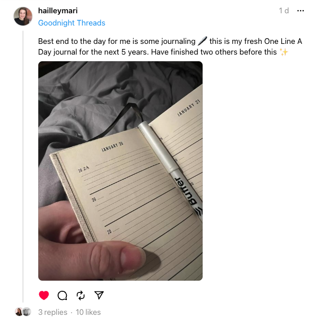 Threads post showing a cozy journaling photo with an open one line a day notebook and pen, highlighting personal content and engagement that helps creators grow on threads.