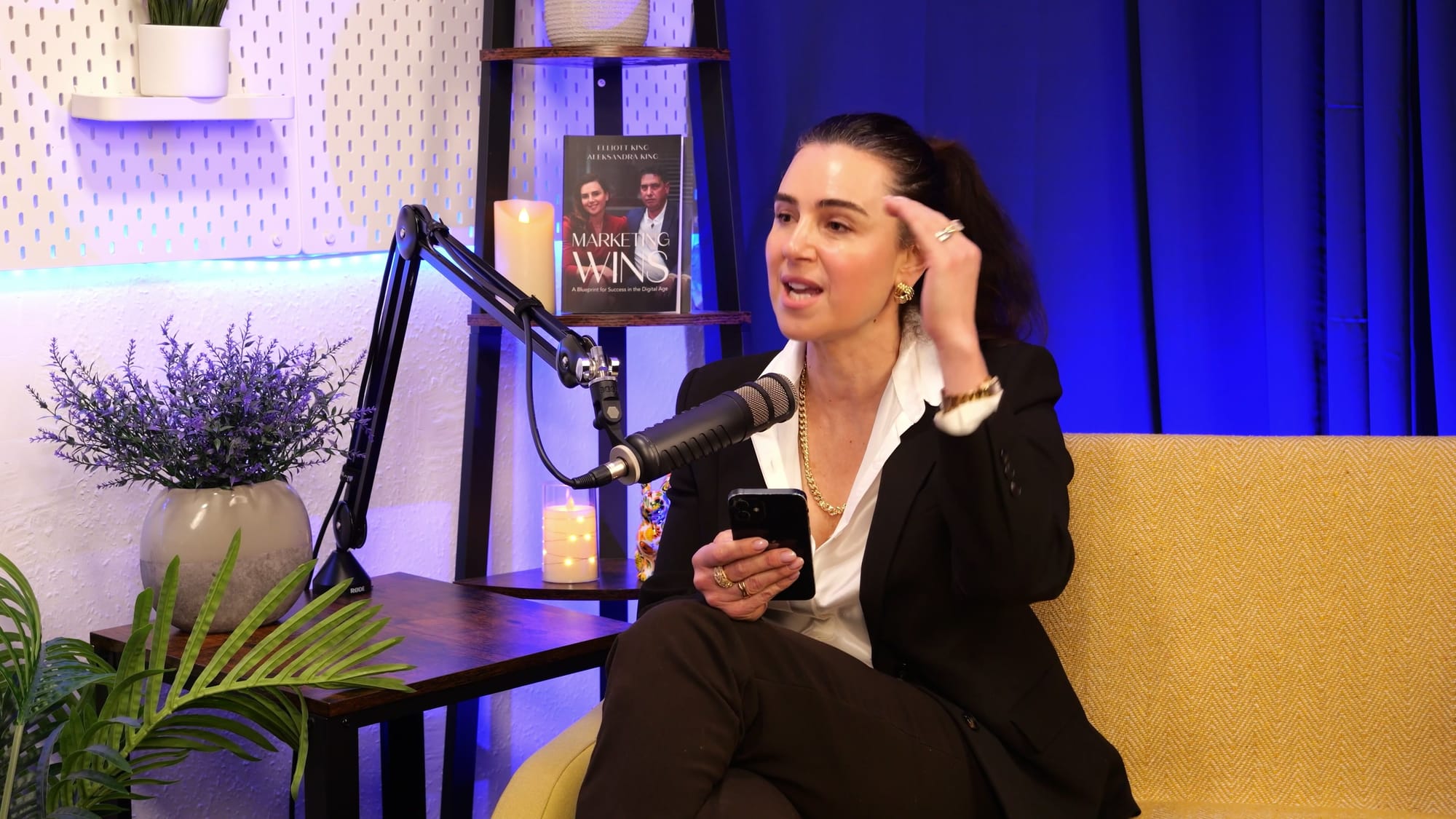 Aleksandra King, host of The BEYOND Podcast, listening in the studio during the Lara Morgan interview episode.