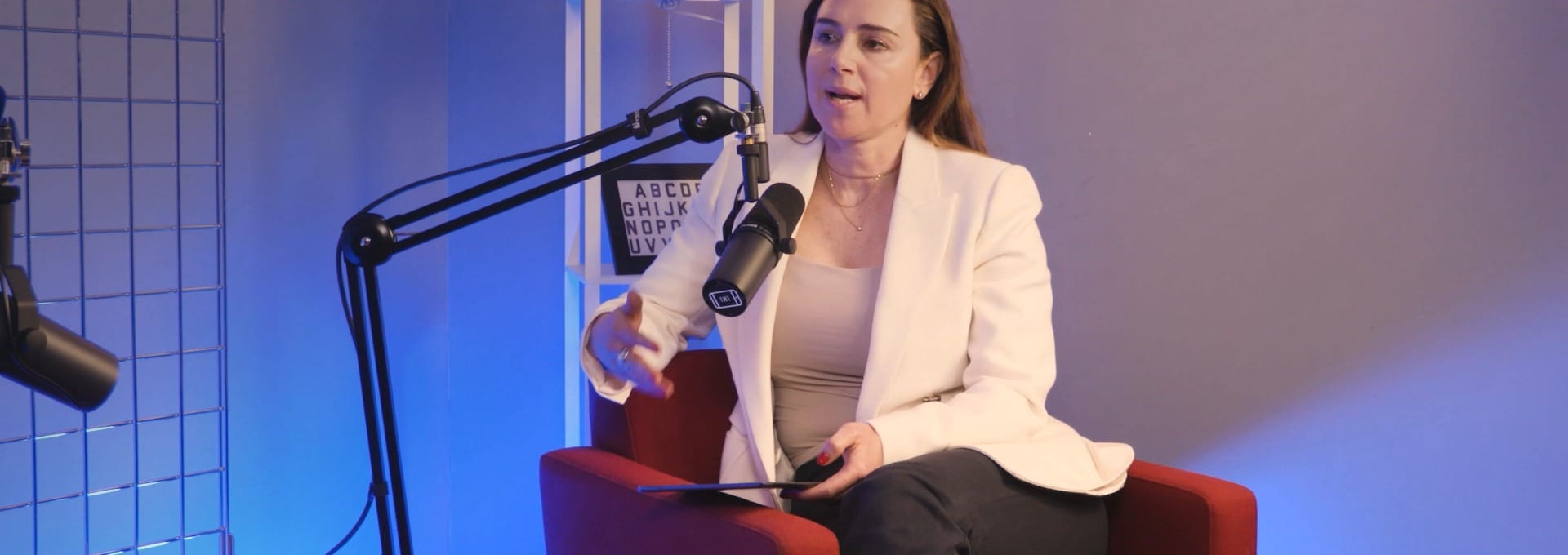 Michelle Niziol listening thoughtfully during her interview on The BEYOND Podcast with Aleksandra King.