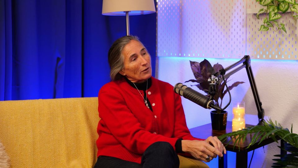 Lara Morgan speaking on The BEYOND Podcast, gesturing mid-answer during the studio interview with Aleksandra King.