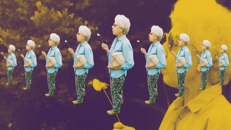 Ruby Dawn Reed with a dandelion