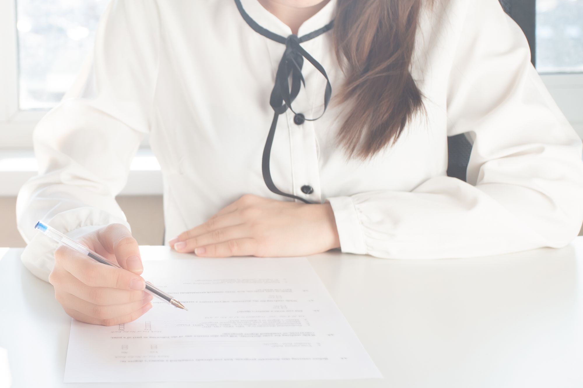 Girl filling in a document