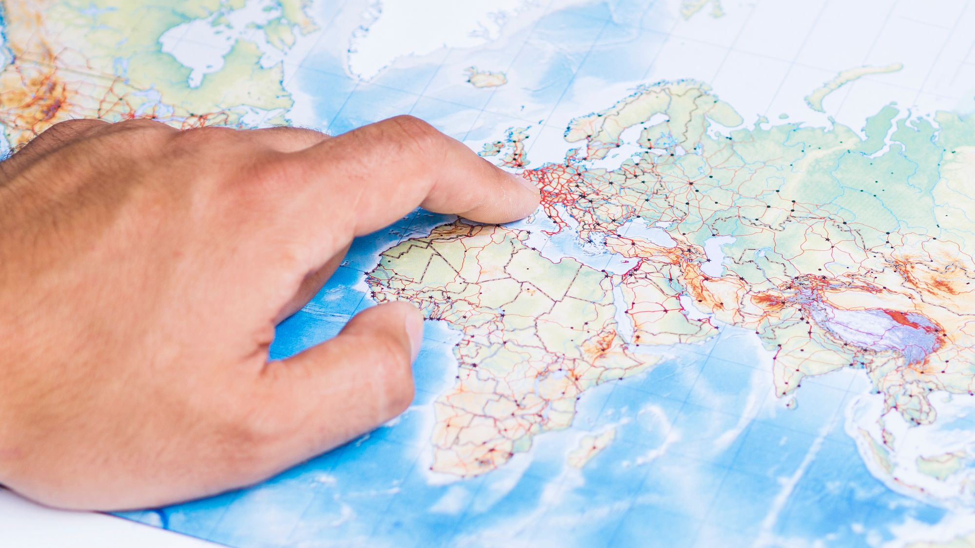 Hand pointing Europe on a map