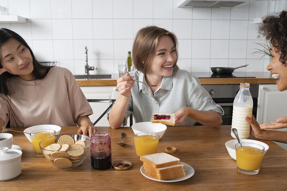Flatmates having breakfast together