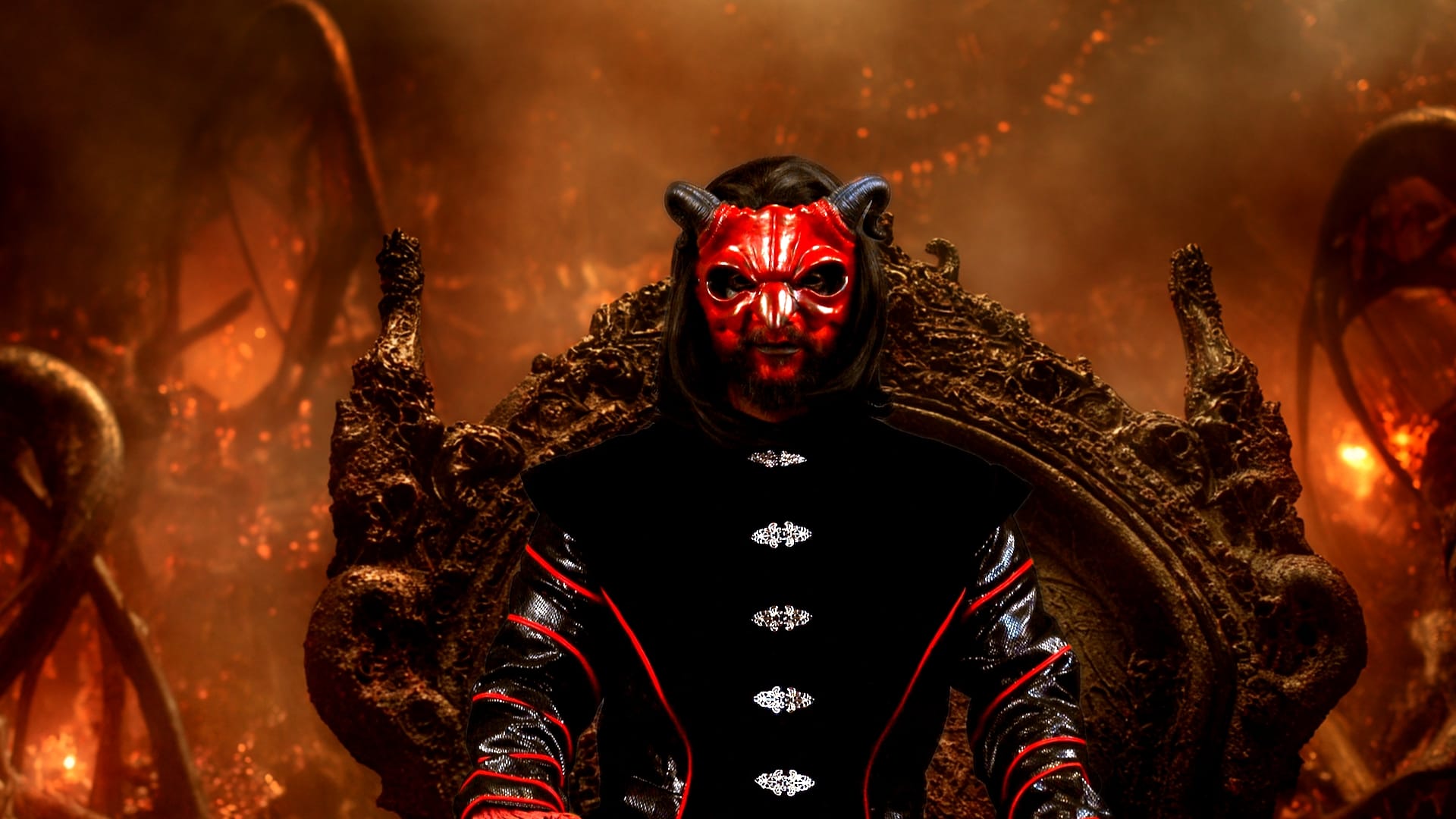 Mephistopheles sits in a chair in small channel hell.