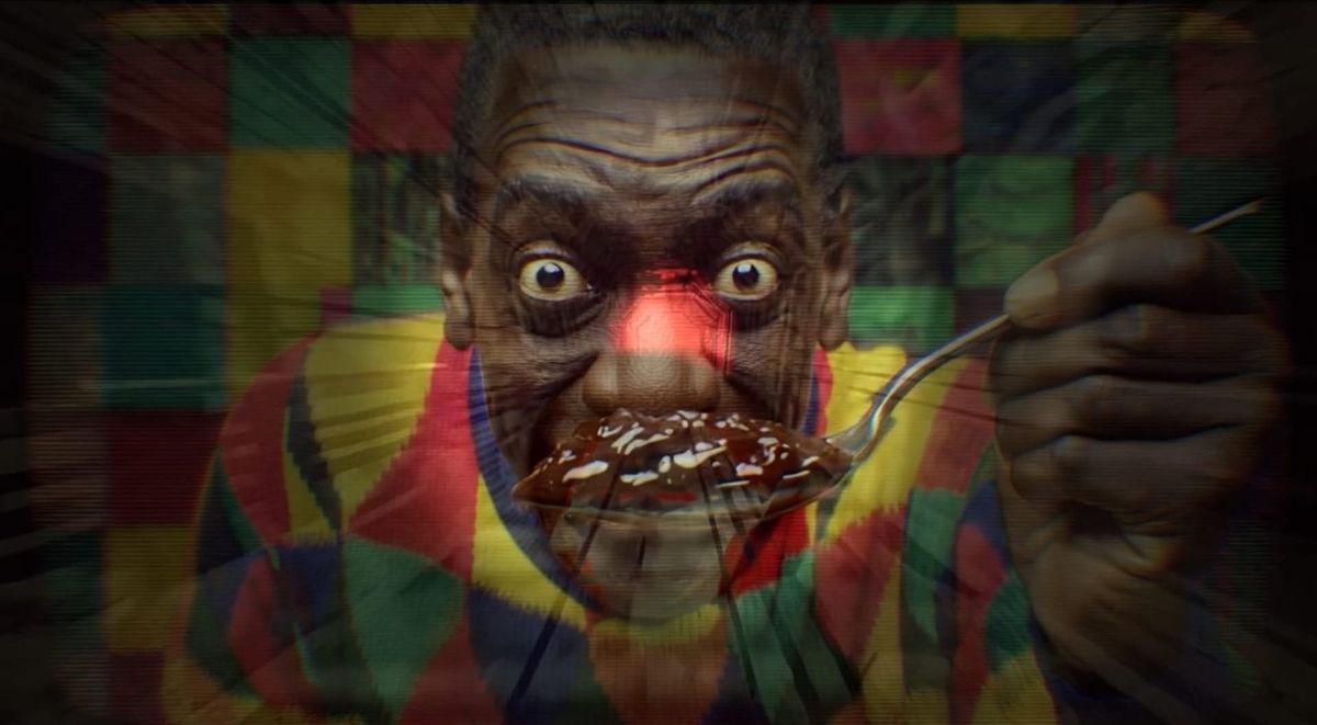 A man who looks a lot like Bill Cosby holds a chocolate substance up to his face.  His eyes are wide.  Smile Forever.