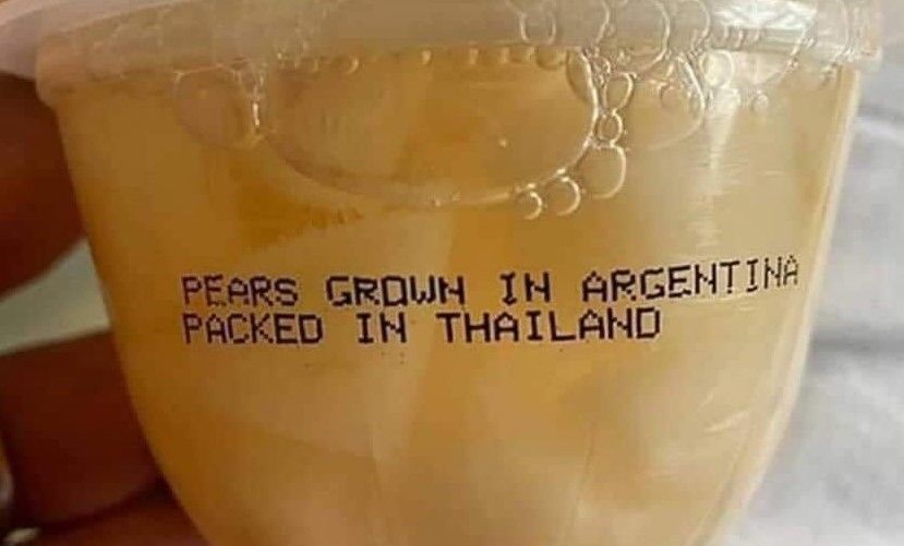 A picture of a small plastic cup of pears. Printed on the side is typed "PEARS GROWN IN ARGENTINA PACKED IN THAILAND."
