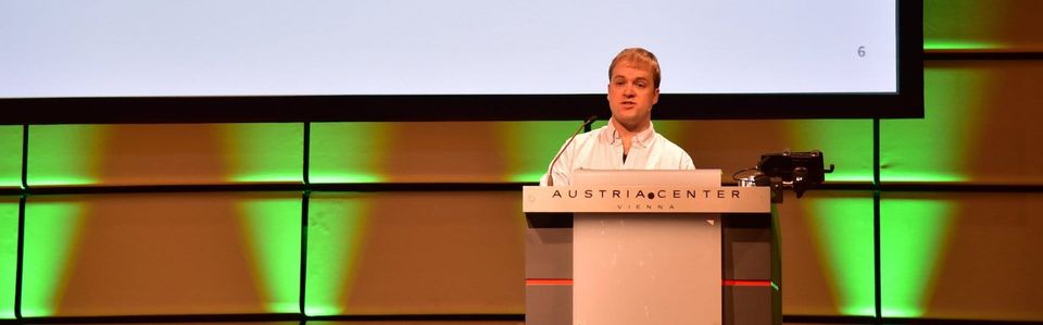 Colm Doyle speaking on stage