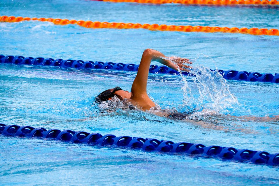 freestyle swimmer in an olympic pool