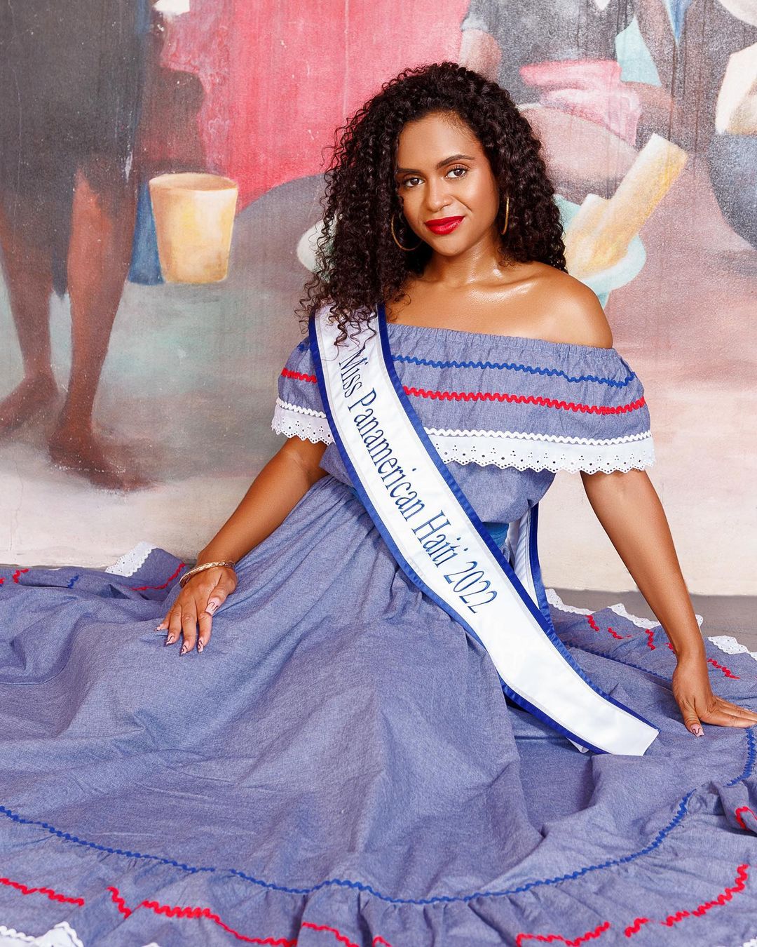 Josephine Lentner with Miss Panamerican Haiti sash, sitting posed in Haitian dress