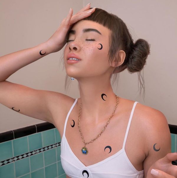 Lil Miquela AI-generated virtual influencer on social media.