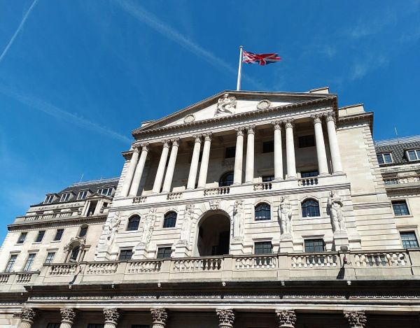 A digital visualization of the UK economy featuring the Bank of England headquarters, inflation trend lines, and financial market charts for 2026.