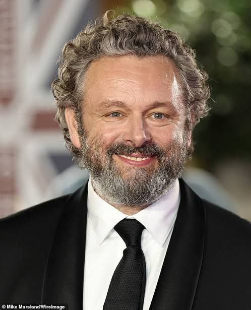 Job reductions in a Welsh town - actor Michael Sheen settles debts of 900 individuals, amounting to £1 million.