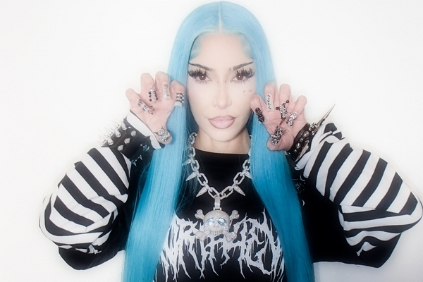 Kim Kardashian Channels Daughter North West for Halloween With Blue Hair & Piercings