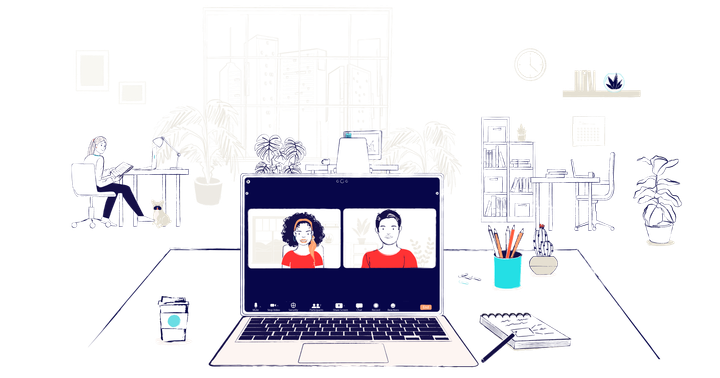 A desk with an open laptop. On the screen a virtual meeting is happening. A man and a woman, both wearing red, are on screen.