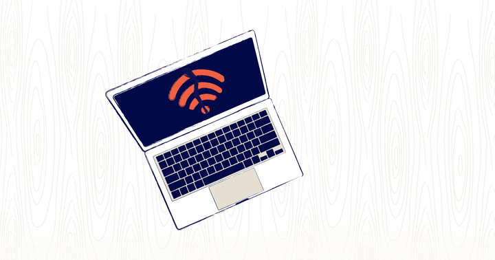 a laptop sits open on a desk. On the screen is a wifi icon, broken in half. 