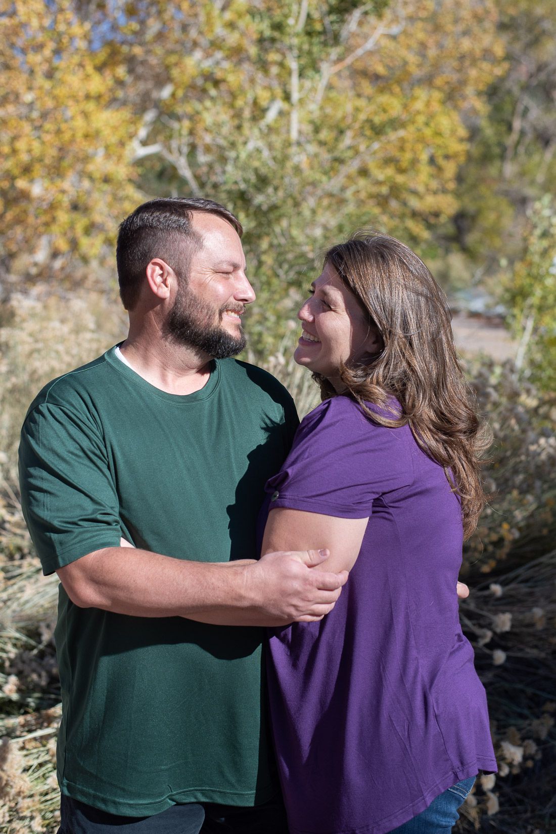 Close-up of Mom and Dad look at each other smiling-Family Photographer, Bethany Allen