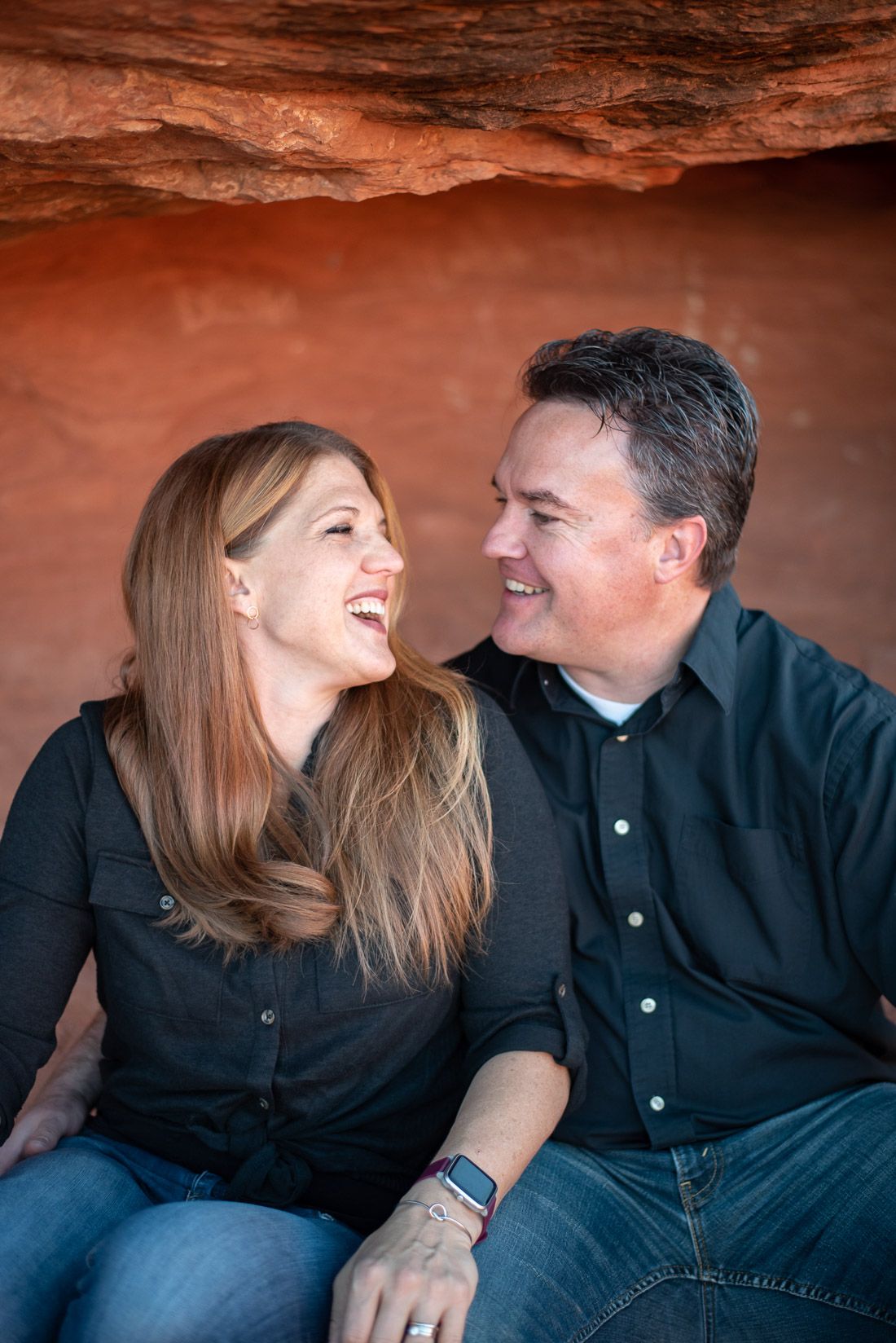 Husband and wife laughing together