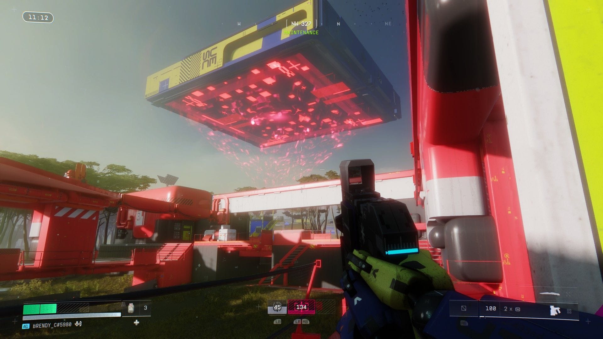 The player looks up at a giant square ship that is beaming a red laser onto the planet's surface.