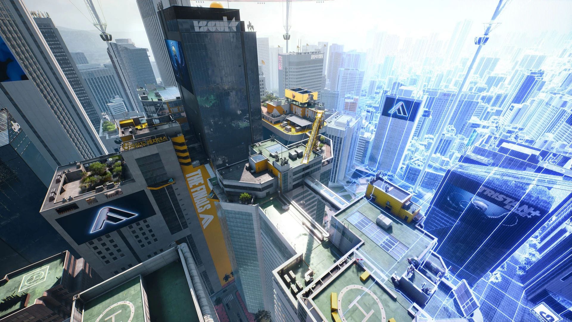 The view of a cityscape from above, with helipads and skyscrapers.