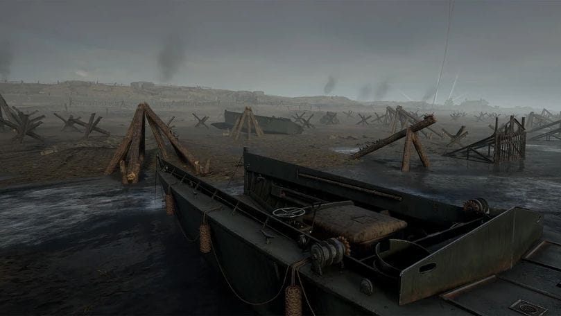 An amphibious landing craft lies empty on a beach during WWII.