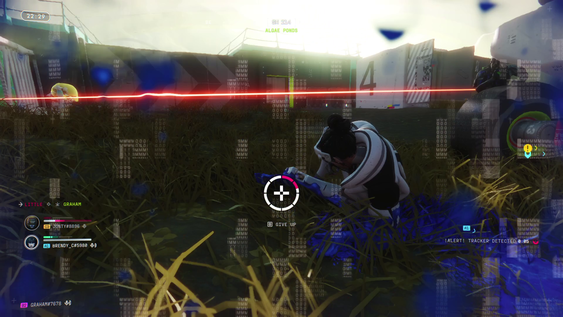 A player lies in the grass, bleeding out, as tracer fire whizzes overhead.
