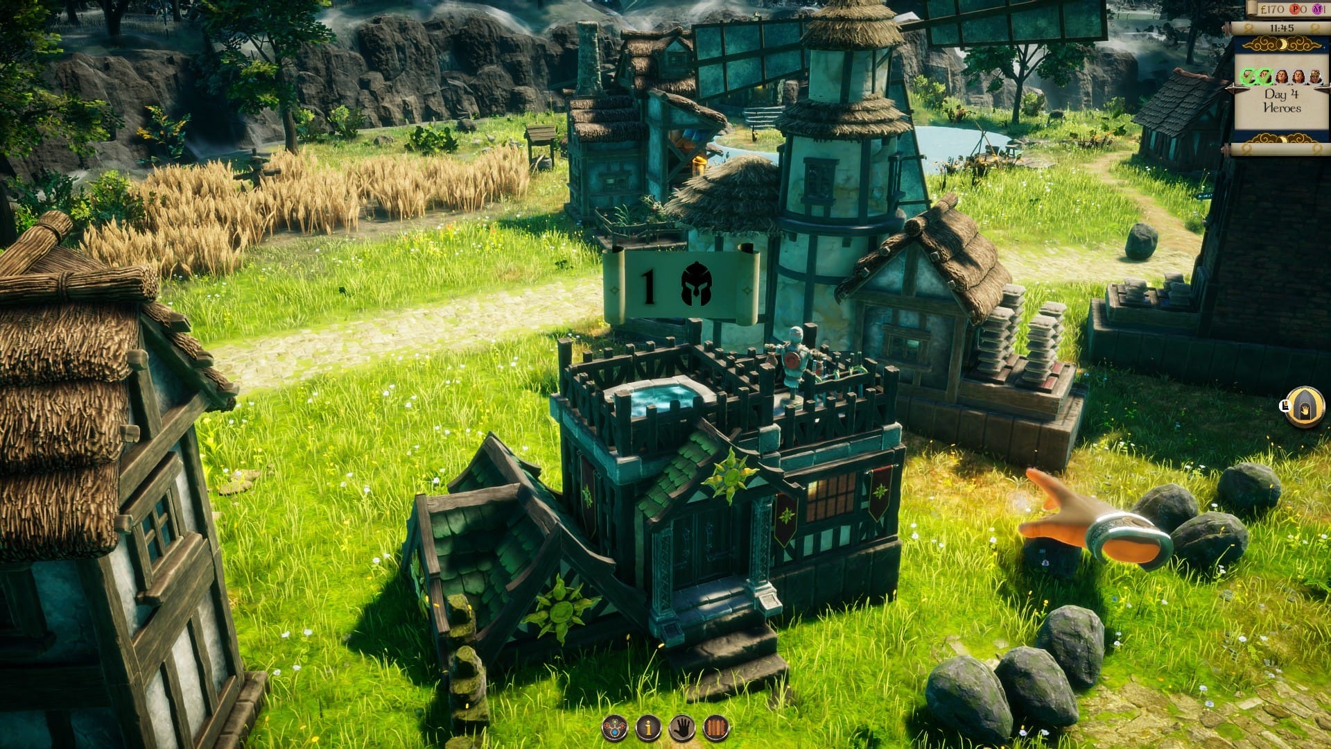A medieval-looking house in a small town, surrounded by grass, wheat fields in the distance.